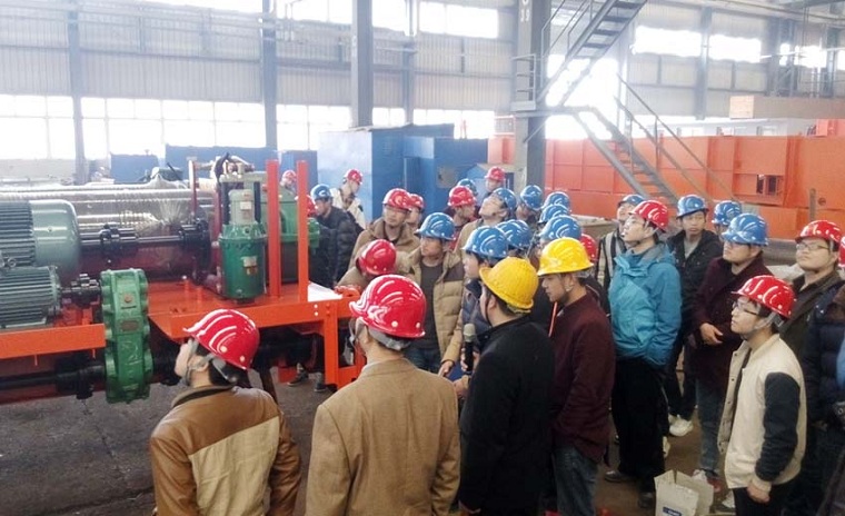 Production leader explain the Weihua Cranes plant layout and manufacturing equipment